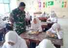 Dukung Program Pemerintah, Babinsa Koramil 02/Bonang Dampingi Penyaluran MBG Di Wilayah Binaan